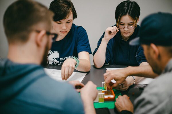 Students work with mentors to build models in a career connected learning program.